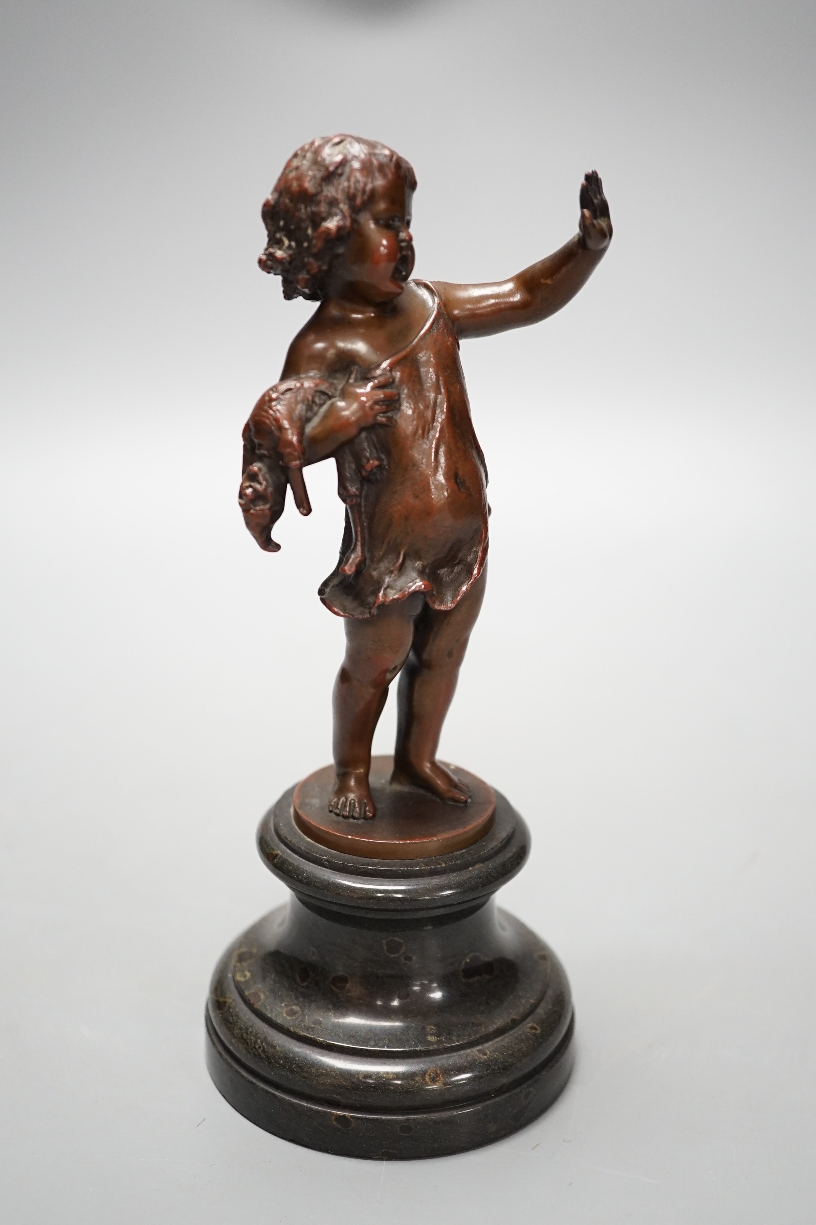 Franz Iffland (German, 1862-1935), bronze of a child holding a Punch puppet, dated 1886 20cm